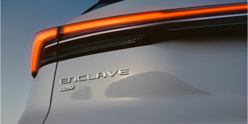 Close-up of Buick Enclave rear LED taillight and model badge detail