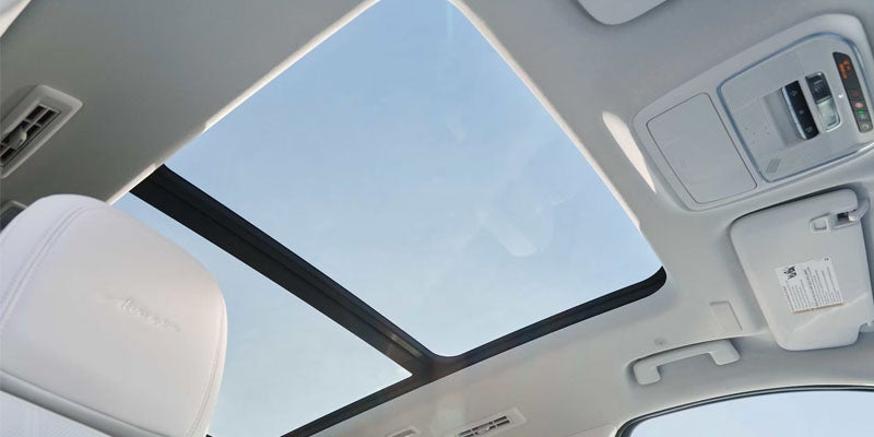 Panoramic sunroof inside a Buick Enclave with bright cabin interior