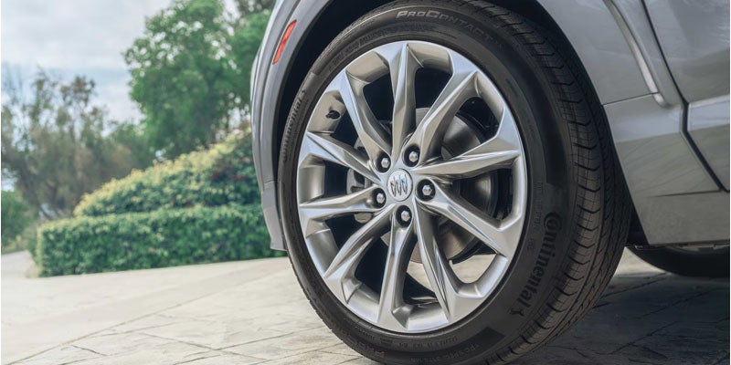 Close-up of Buick alloy wheel and tire with premium multi-spoke design
