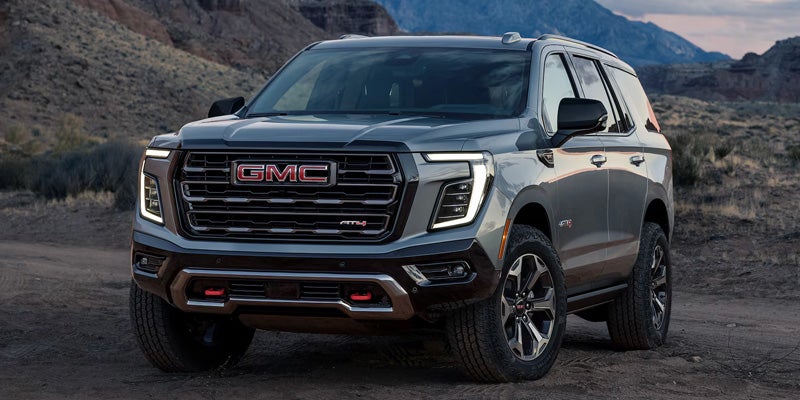 Front three-quarter exterior view of a silver GMC SUV